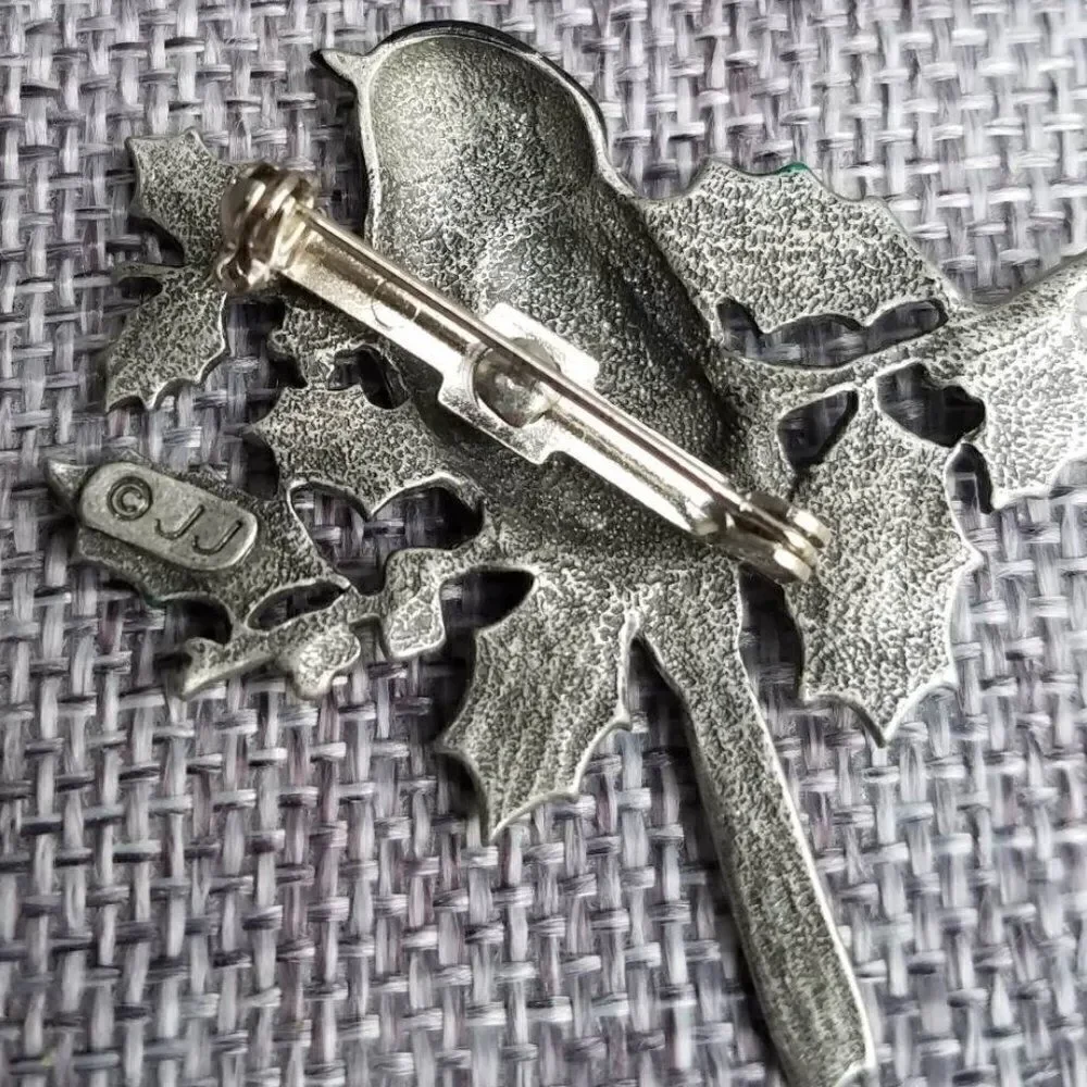 Vintage signed J J Jonette Bird on Holy Brooch